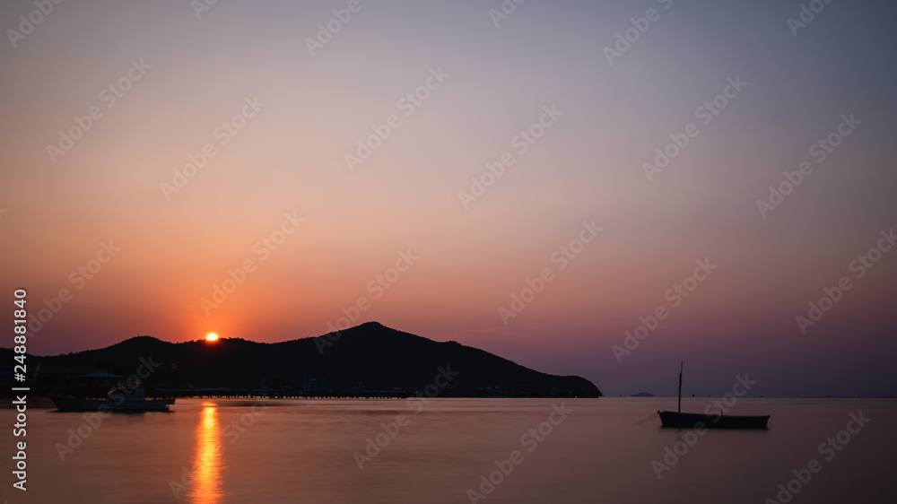 silhouette of fishing boat on the sea at sunset