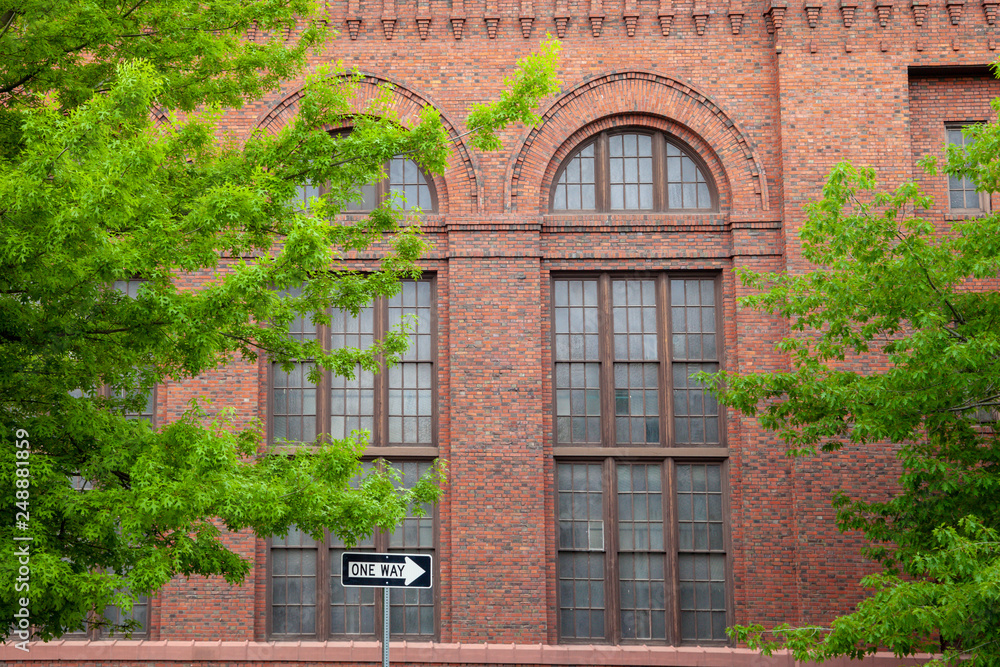 A red brick building with green trees in Spokane, Washington, USA