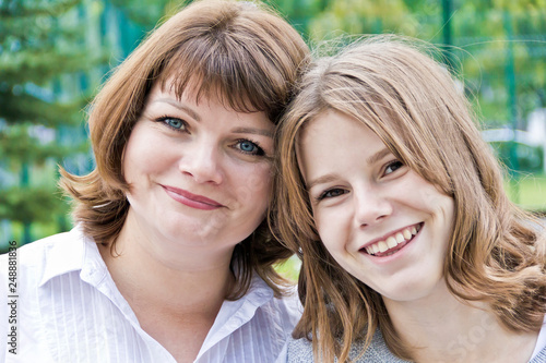 Happiest mother and daughter fourteen years old