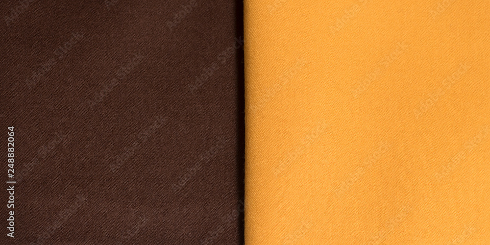 Fototapeta premium Backgrounds and textures. Brown and orange cotton fabric close-up
