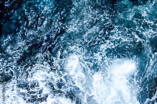 Blue deep sea foaming water background