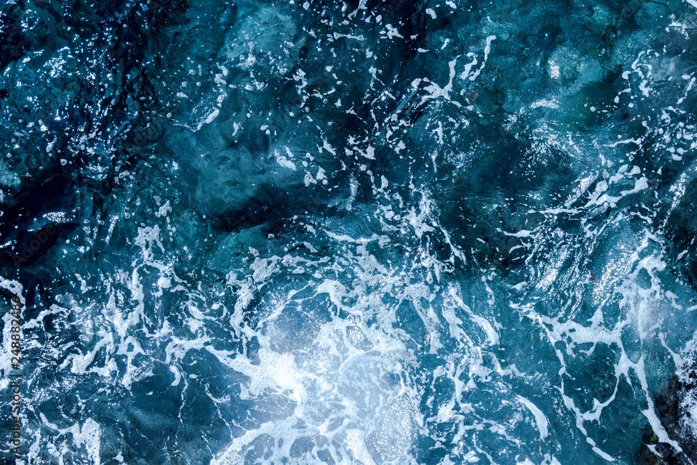 Blue deep sea foaming water background