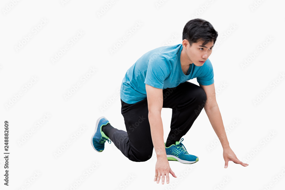 Man wearing sportswear poses ready to run Man wearing sportswear poses ready to run