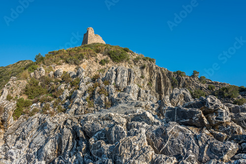 Ancient Lighthouse on a Hill on the Southern Italian Mediterranean Coast