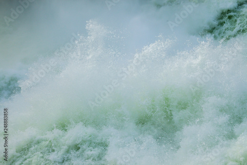 Canvas-taulu The Spokane river in spring flood near downtown Spokane, Washington, USA