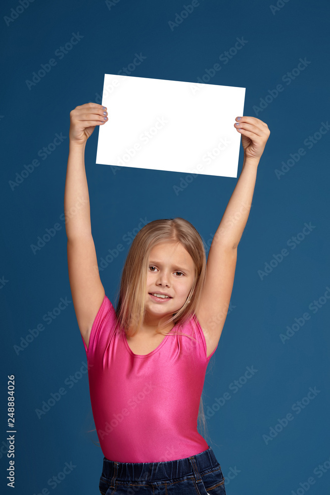 Portrait of adorable emotional little girl on blue background Portrait of adorable emotional little girl on blue background