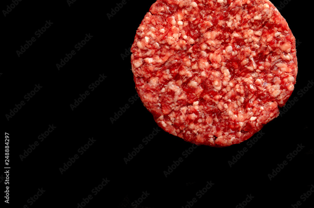 Raw hamburger with black background Raw hamburger with black background