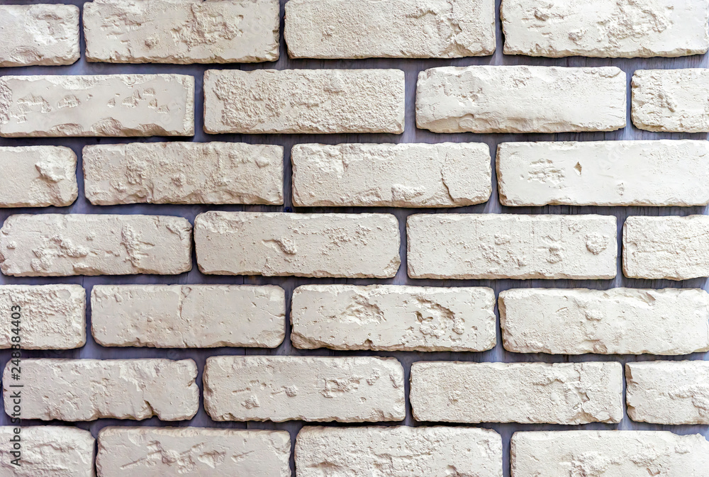 The texture of light yellow bricks for decoration of the facade of the building or interior. The texture of light yellow bricks for decoration of the facade of the building or interior.
