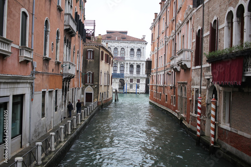 Ancient building surround with water in Venice on the canal, lifestyle in Italy, boat trip in Venezia, commercial advertisement