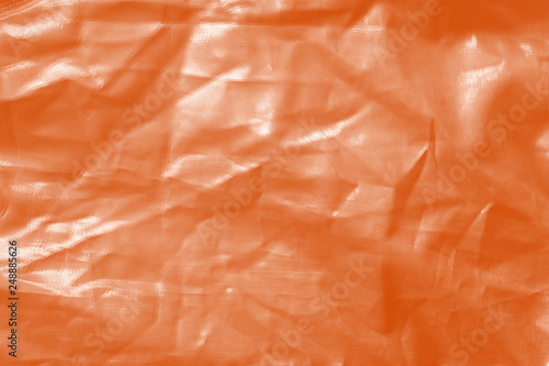 Elegant orange textile background. Silk cloth texture. Fabric pattern. © artistmef
