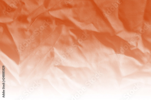 Elegant orange textile background. Silk cloth texture. Fabric pattern.