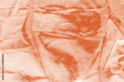 Elegant orange textile background. Silk cloth texture. Fabric pattern.