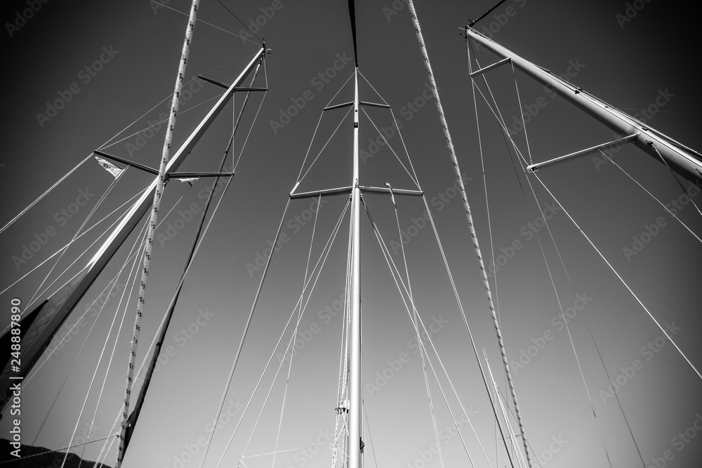 Fototapeta premium Masts of three sailing boats.