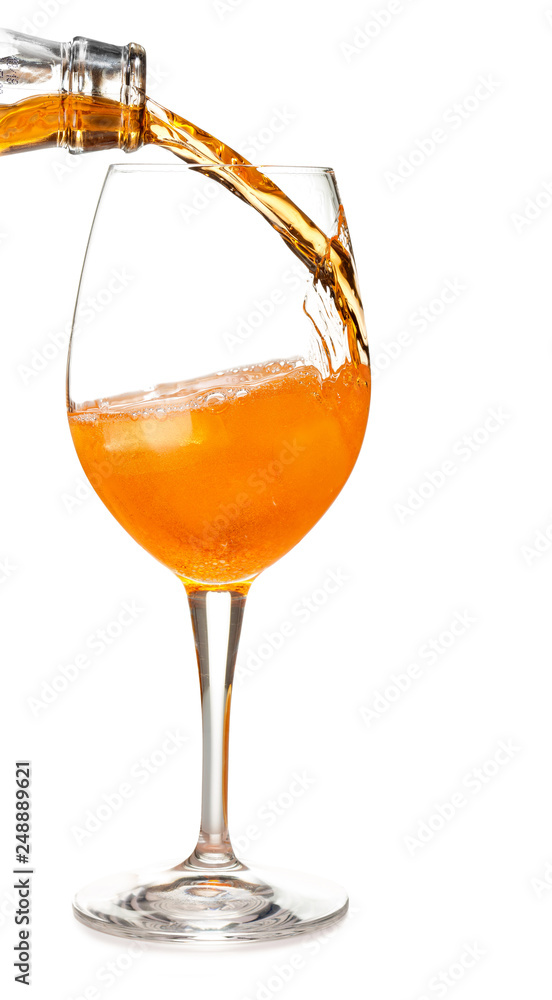 pour aperol in a spritz cocktail isolated on white