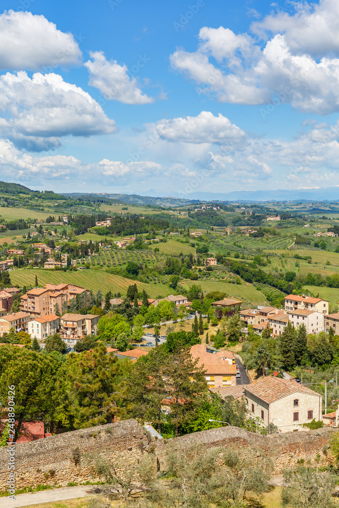 Aerial view of the city of San Gimignano with a rural landscape in Tuscany