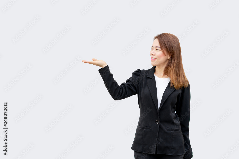 asian business woman presenting hand with long hair in black suit isolated on white color background asian business woman presenting hand with long hair in black suit isolated on white color background