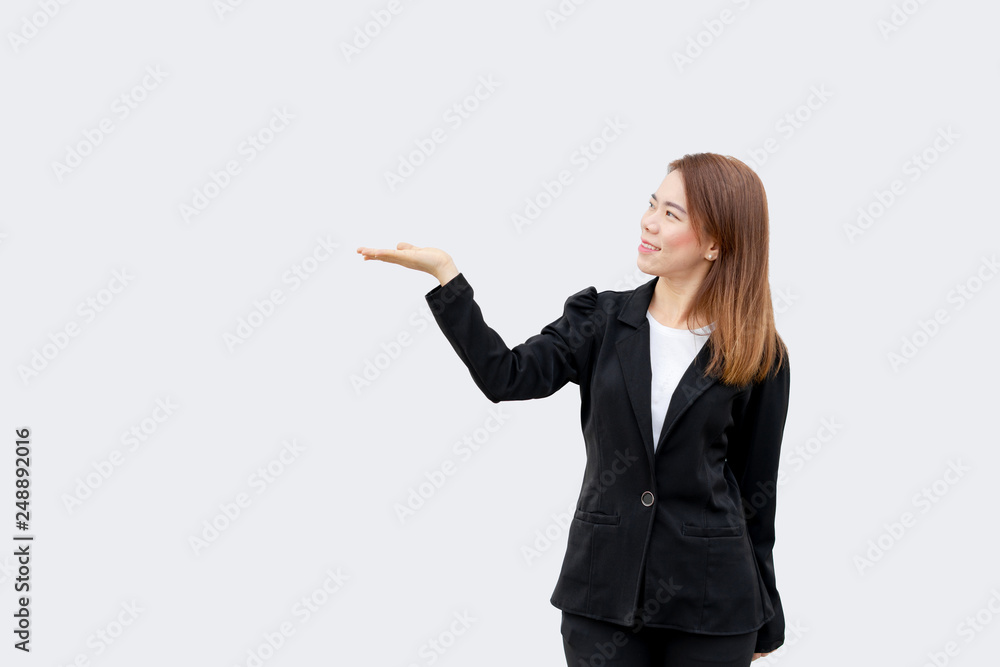 asian business woman presenting hand with long hair in black suit isolated on white color background asian business woman presenting hand with long hair in black suit isolated on white color background