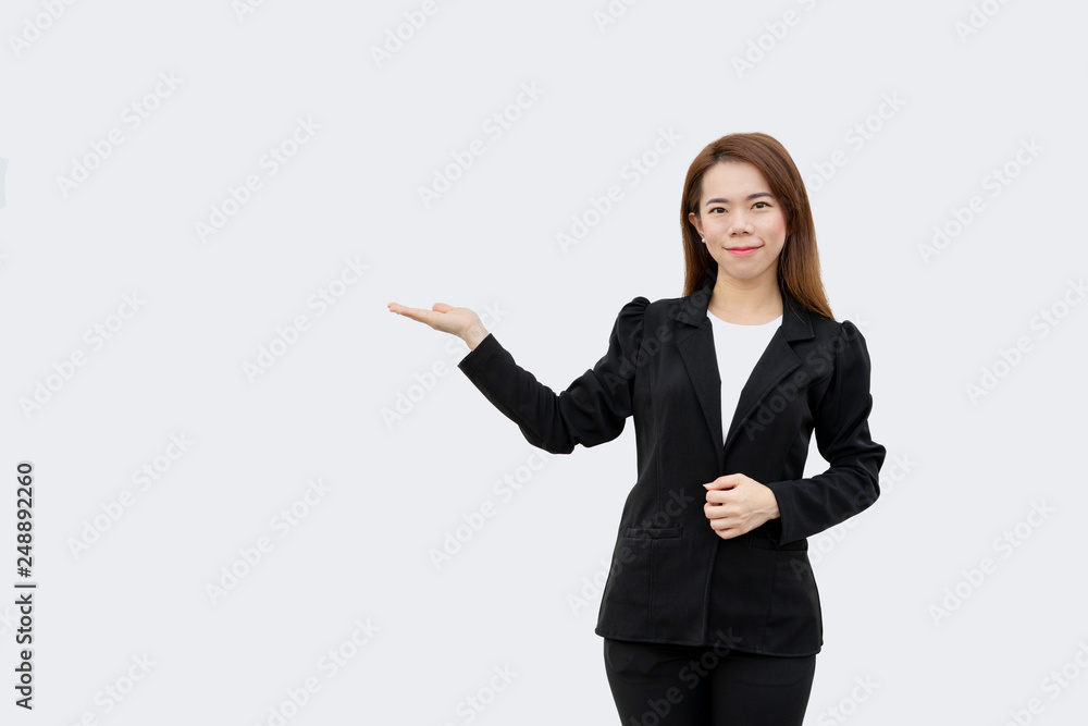 asian business woman presenting hand with long hair in black suit isolated on white color background asian business woman presenting hand with long hair in black suit isolated on white color background