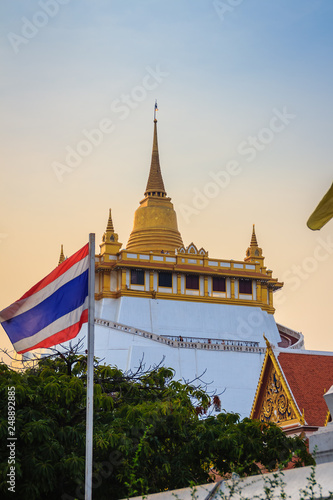 Beautiful Thai flag at front of  Wat Saket Ratcha Wora Maha Wihan  Wat Phu Khao Thong  Golden Mount temple   a popular Bangkok tourist attraction and has become one of the symbols of the city.