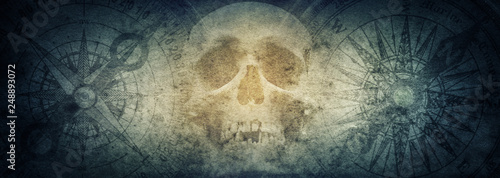 Pirate skull and compasses on old grunge paper background.