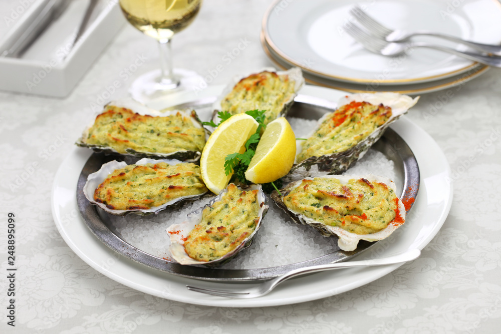 oysters rockfeller, baked oysters on half shell topped with green sauce and bread crumbs