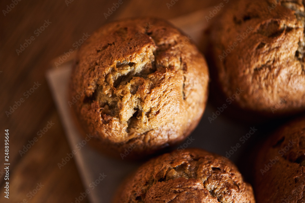 Fototapeta premium Freshly baked muffins cooling on a bakery table