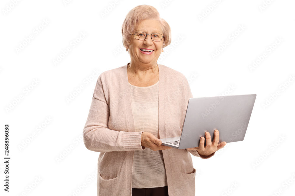 Happy senior woman holding a laptop computer Happy senior woman holding a laptop computer