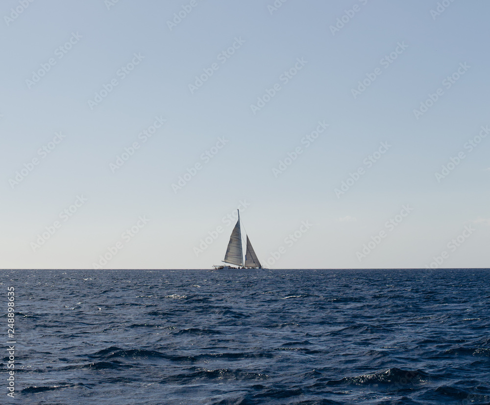 Sailboat on quiet peaceful sea
