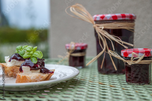 Obraz na plátně Homemade sloe jams on the rustic table