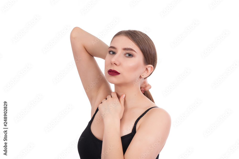 Portrait of a young beautiful girl with make-up isolated on white background. A woman holds her long hair with her hand. Portrait of a young beautiful girl with make-up isolated on white background. A woman holds her long hair with her hand.
