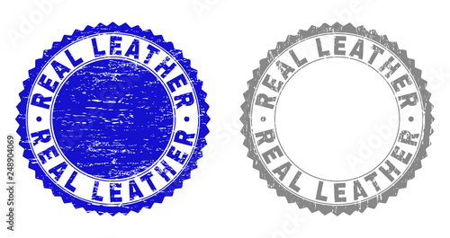 Grunge REAL LEATHER stamp seals isolated on a white background. Rosette seals with grunge texture in blue and gray colors. Vector rubber stamp imprint of REAL LEATHER text inside round rosette.