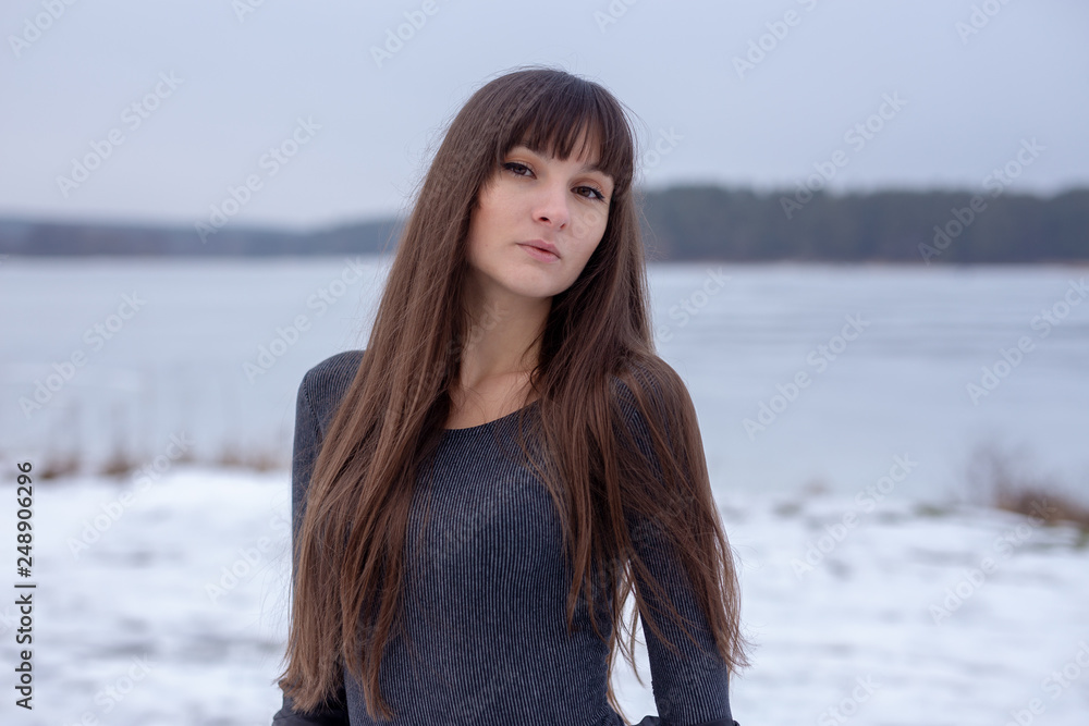 Pretty girl outdoor winter portrait on the ice lake Pretty girl outdoor winter portrait on the ice lake