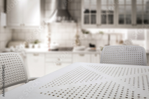 White kitchen table with chairs and free space for your decoration. 