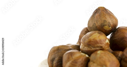 raw hazelnuts isolated on white background