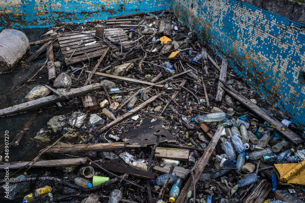 Obraz premium Polluted with plastic swimming pool of Berengaria abandoned hotel in mountain region of Trodos, Cyprus