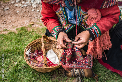 Hands of a Peruvian women knitting