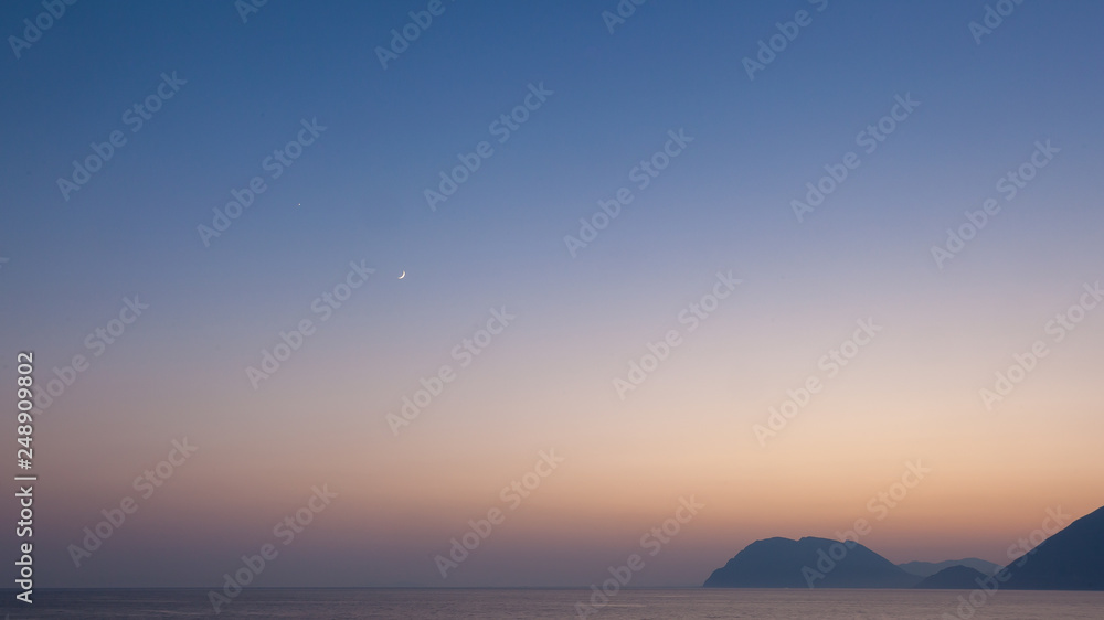 Beatiful evening on Greece seaside with moon