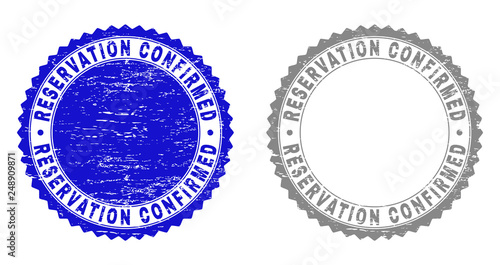 Grunge RESERVATION CONFIRMED stamp seals isolated on a white background. Rosette seals with grunge texture in blue and gray colors.