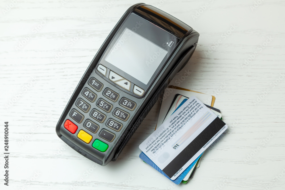 POS terminal, Payment Machine with credit card isolated on white background. Contactless payment with NFC technology. POS terminal, Payment Machine with credit card isolated on white background. Contactless payment with NFC technology.