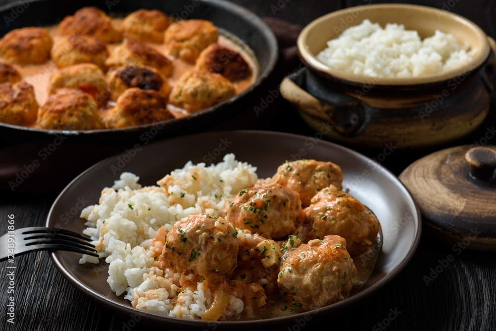 Turkey meatballs in tomato sauce with mascarpone served with boiled rice. Turkey meatballs in tomato sauce with mascarpone served with boiled rice.