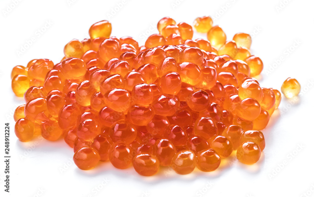 Red caviar on white background. Top view. Macro picture. Red caviar on white background. Top view. Macro picture.