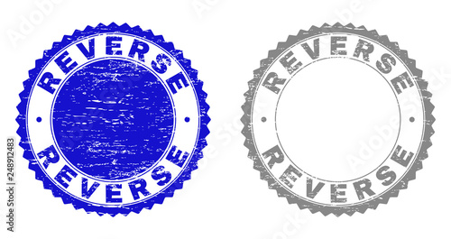 Grunge REVERSE stamp seals isolated on a white background. Rosette seals with grunge texture in blue and gray colors. Vector rubber stamp imprint of REVERSE caption inside round rosette.