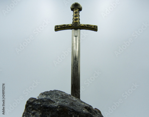 Excalibur the mythical sword in the stone of king Arthur photo