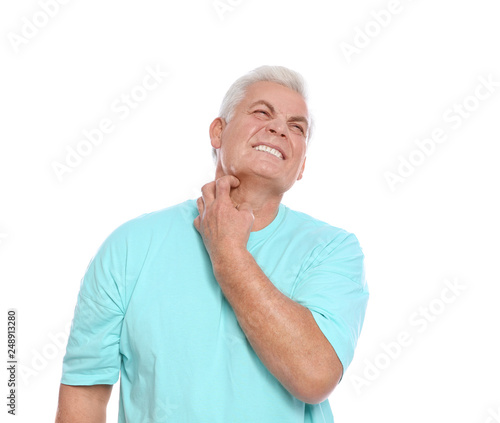 Mature man scratching neck on white background. Annoying itch