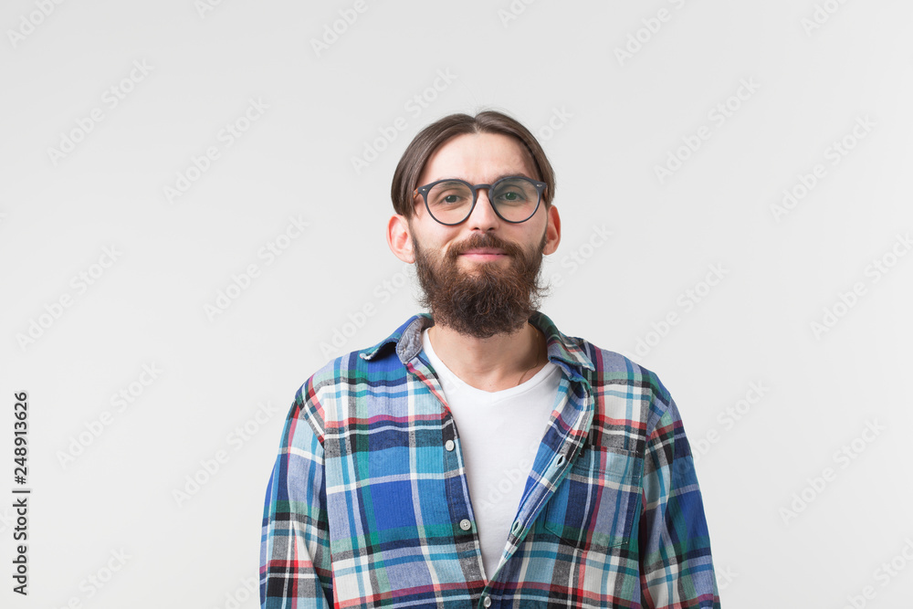 Portrait of a young bearded hipster stylish guy over white background. Portrait of a young bearded hipster stylish guy over white background.