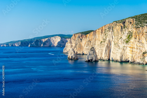 Greece, Zakynthos, Silent ocean water alongside giant cliffs at islands seaside near agalas