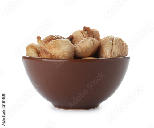 Bowl with figs on white background. Dried fruit as healthy food