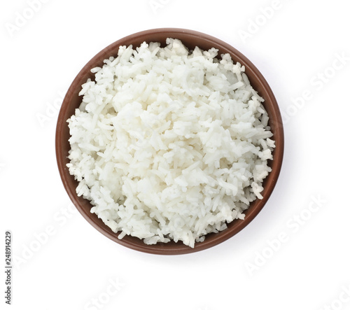 Bowl of boiled rice on white background, top view