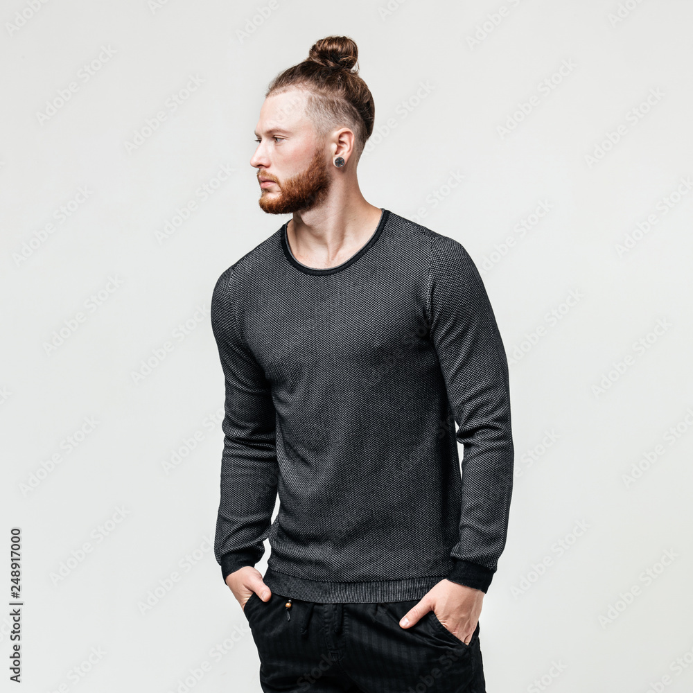 bun hairstyle wearing a gray jumper 