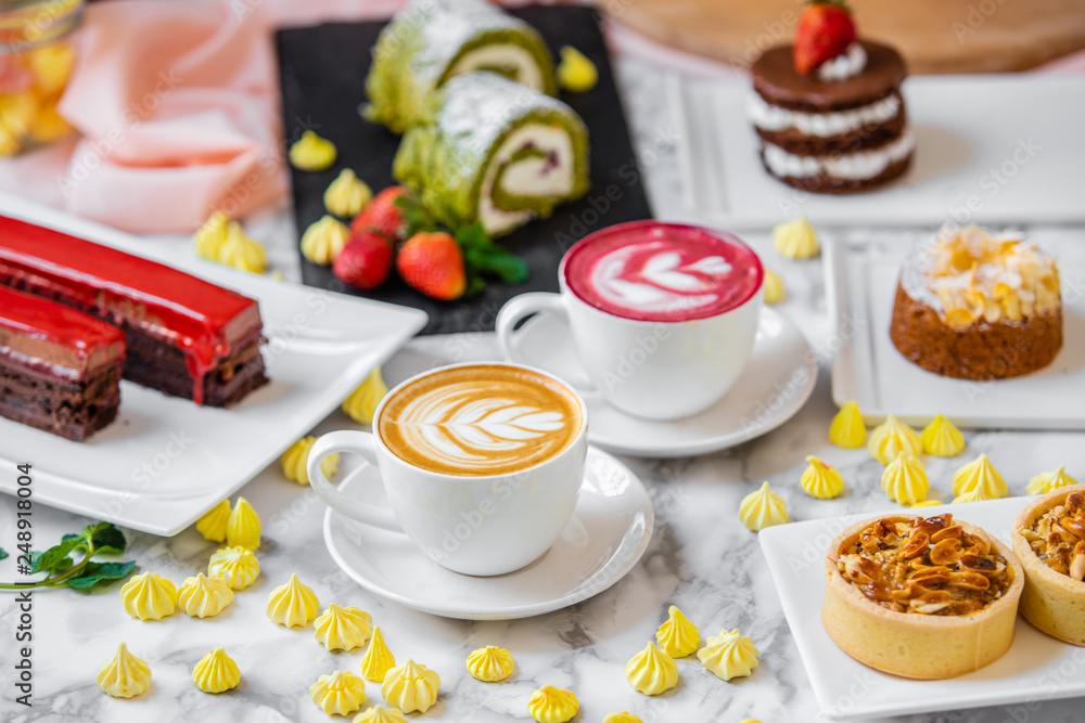 delicious composition of latte tea with cakes delicious composition of latte tea with cakes